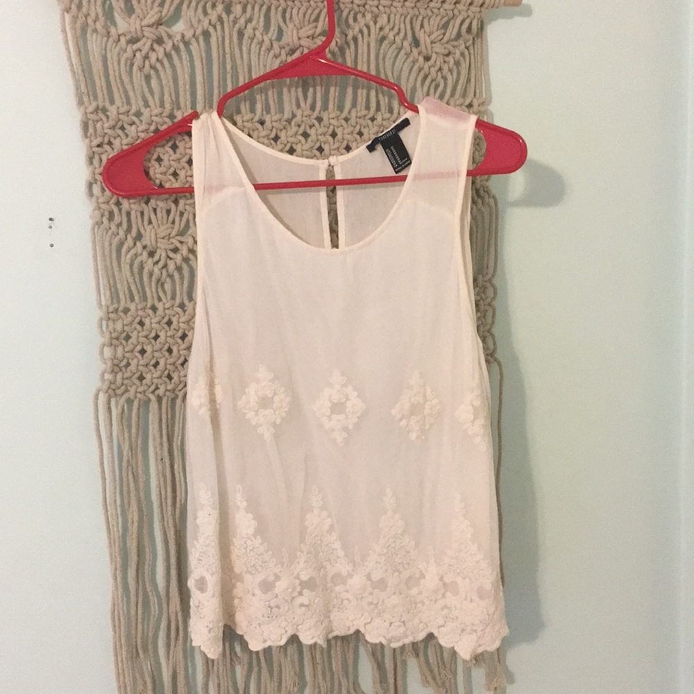 cream tank top with embroidered pattern